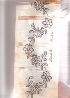 a piece of paper with flowers drawn on it