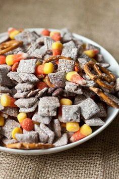 a white plate filled with corn and cheetos on top of a table