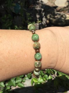 Natural  rainforest jasper in different shades of green make a unique interesting bracelet. This bracelet fits a seven inch wrist but can be altered. Beads are 8 mm and each one is unique! It has some really interesting spacer beads to add a fancy touch. Cheap Green Hypoallergenic Bracelets, Cheap Green Braided Bracelets For Women, Earthy Bracelets Aesthetic, Cheap Green Braided Bracelets For Festivals, Green Beaded Bracelets For Gifts, Nature-inspired, Green Nature-inspired Beaded Bracelets For Gift, Green Nature-inspired Beaded Bracelets As Gift, Nature-inspired Green Beaded Bracelets For Gift, Casual Green Agate Bracelets