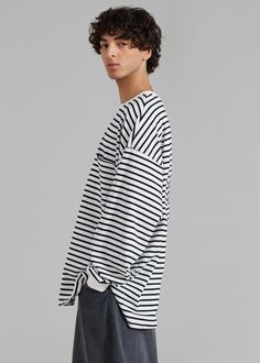 Color: Black/White Stripe Soft cotton fabric Relaxed fit Crew neckline Drop shoulders Striped pattern Ribbed trim Straight hem with side slits Unlined 100% Cotton Machine Wash Cold By The Frankie Shop. Imported The Frankie Shop, Frankie Shop, Pocket Tee, Stripes Pattern, Black Tee, Drop Shoulder, Crew Neckline, White Stripe, Cotton Fabric