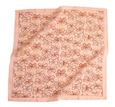 a pink scarf with brown butterflies on it