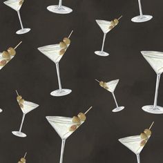 several martini glasses with olives on a black background, painted in acrylic