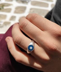 Evil eye ring. Its hand painted in 2 colors, the traditional blue or the elegant white! * You can pick between 925 silver plated or 24k gold plated. Everything is handmade from the scratch with love and care. All the parts are nickel free and antiallergic .. * 2 adjustable sizes! 1)Rings Diameter is 17mm (0.67'') - US 7 Dimensions 19,9x16,5 mm (0.78''x 0.70') 2)Rings Diameter is 20mm (0.78'') - US 10 Dimensions 19,9x16,5 mm (0.78''x 0.70') Evil eye meaning The evil eye brings good luck and prote Sterling Silver Evil Eye Ring For Gift, Sterling Silver Evil Eye Ring As Gift, Blue Evil Eye Round Ring, Adjustable Symbolic Blue Rings, Symbolic Adjustable Blue Rings, Blue Spiritual Ring With Evil Eye, Spiritual Blue Ring With Evil Eye Detail, Spiritual Blue Rings With Evil Eye Detail, Symbolic Blue Ring As Gift