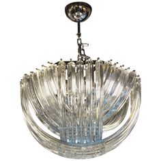 a glass chandelier hanging from the ceiling