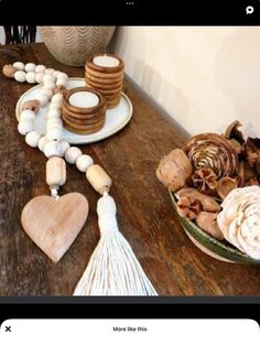 a wooden table topped with lots of cookies and marshmallows on top of it