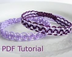 two purple and white crocheted bracelets on a plate with the text, free pattern