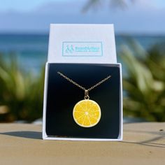 Unveil a zest of elegance with our Lemon Charm Necklace, meticulously handcrafted with love in the heart of Chichester. Opt to pair it with our matching Lemon Earrings to complete a citrus-themed ensemble that's fresh as a summer breeze. Every order is tenderly packaged within a charming Organza bag, ready to gift or treasure. Dispatched swiftly within one working day via complimentary standard 2nd class delivery. Should you desire a quicker arrival, simply upgrade to our express 1st class deliv Green Pearl Earrings, Lemon Earrings, Food Necklace, Fruit Necklace, Summer Jewellery, Orange Necklace, Fruit Jewelry, Chichester, Food Jewelry