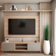 a modern living room with a flat screen tv mounted on the wall and wooden shelves