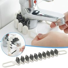 a person is fixing a sink faucet with toothbrushes and clips on it