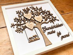 a family tree with two hearts hanging from it's branches and the words, grandkilnan made by grandma