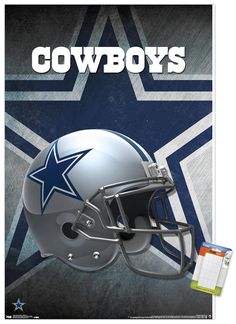 a football helmet with the word cowboys on it and a notepad next to it