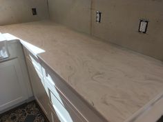 a kitchen counter that is being built into the wall