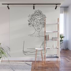 a drawing of a woman's face with flowers in her hair wall mural print