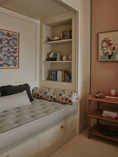 a living room with a couch and bookshelf