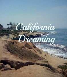 the words california dreaming are overlaid by sand and water