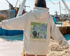 Subscribe and save! Grab your exclusive discount when you join our mailing list! Copy and paste this link into your browser: https://bit.ly/chaseandsunsetsco Add a touch of whimsy and artful elegance to your wardrobe with our Van Gogh Irises Black Cat Hoodie. This unique and cozy pullover combines the timeless beauty of Vincent Van Gogh's famous "Irises" painting with a playful twist, featuring a mischievous black cat. A perfect combo for the ultimate cat loving/art collecting enthusiast. PRODUC Van Gogh Shirt, Vincent Van Gogh Irises, Irises Painting, Van Gogh Aesthetic, Dark Academia Shirt, Gift For Artist, Van Gogh Irises, Snow Activities, Cat Themed Gifts