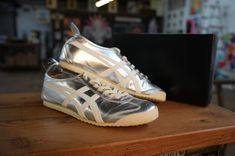 🌟👟 Iconic Flashback: Pre-Owned Onitsuka Tiger MEXICO 66 in Shimmering Silver - Great Condition + Rep Box 👟🌟 Vintage Vibes Meet Modern Swag! Lace up a piece of history with these timeless Onitsuka Tiger MEXICO 66 sneakers in dazzling Silver. Not just a pair of shoes, but a journey back in time to when sneakers started to spell fashion. Pre-owned? More like pre-loved, with every step telling a story of style and sophistication. Why It’s A Must-Have: Condition: Pre-owned in great condition. Carefully loved and meticulously maintained. They’ve seen the world but haven’t let it wear them down. Color: The Silver hue isn’t just silver; it’s a statement. Ready to shine brighter than ever and turn heads with every step? Size: Perfectly fitting, check the listing for your golden ticket to style. Onitsuka Tiger Women, Tiger Shoes, Tiger Mexico 66, Onitsuka Tiger Mexico 66, Mexico 66, Asics Shoes, Onitsuka Tiger, Pretty Shoes, Sneaker Shopping