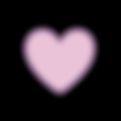 a pink heart on a black background with the light reflecting off it's side