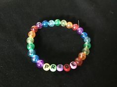 Rainbow Pride themed beaded bracelet for kids, teens and adults Celebrate Pride this June with a bracelet of your very own! 18cm around  The elastic pulls easily over your hand and fits comfortably around the wrist Multicolor Pride Bracelets For Gift, Multicolor Pride Bracelets As A Gift, Multicolor Bracelets For Pride Gift, Multicolor Bracelets For Pride, Adjustable Round Beaded Bracelets For Rave, Multicolor Themed Beaded Bracelets For Friendship, Multicolor Themed Stretch Bracelet For Friendship, Adjustable Themed Stretch Bracelet As Gift, Novelty Stretch Bracelet With Colorful Beads