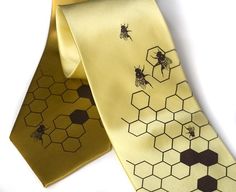 two ties with bees and honeycombs on them, one yellow tie the other brown