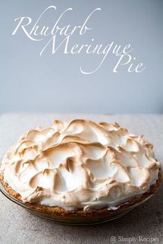 a pie sitting on top of a table covered in frosting