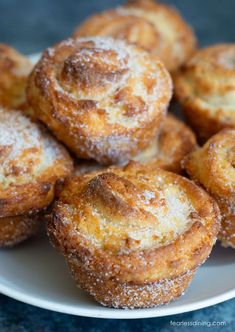 a white plate topped with sugar covered pastries