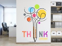 there is a wall sticker with the words think different on it in an office