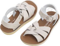 Classic Sandals With Woven Sole And Round Toe, Classic Beige Sandals With Buckle Closure, Classic Adjustable Round Toe Sandals, Classic Closed Toe Cream Sandals, Classic Cream Closed Toe Sandals, Beige Classic Sandals With Round Toe, Classic Beige Sandals With Round Toe, Adjustable Beige Sandals With Rubber Sole, Classic Adjustable T-strap Sandals For Beach