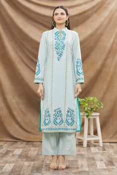 Ice blue kurta with floral embroidered motifs and band collar. Comes with palazzo and shaded dupatta.
Component: 3
Pattern: Embroidery
Type Of Work: Thread
Neckline: Band
Sleeve Type: Full
Fabric: Cotton Silk
Color: Blue
Other Details: 
Dupatta with scallop border
Side slits
Palazzo with scallop trim on the hems
Occasion: Puja - Aza Fashions Shaded Dupatta, Kurta Palazzo Set, Scallop Border, Blue Kurta, Embroidered Motifs, Palazzo Set, Silk Kurta, Scallop Trim, Pattern Embroidery