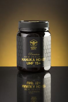 a jar of honey sitting on top of a table