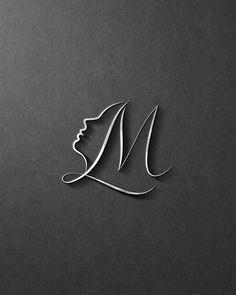 a woman's face with the letter n in silver on a black background,