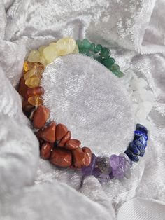 7 Chakra Natural Double Crystal Chip Handmade Stretch Bracelet. Genuine Healing Chunky Chip Gemstones gift for him and for her. -> Perfect for Gift for any occasion The word 'chakra' is derived from the Sanskrit word which means 'wheel'. The Chakras are the energy centres in our body in which energy flows through. Our body has seven of these major energy centres namely, Muladhara - Root Chakra - Amethyst Svadhisthana - Sacral Chakra - Lapis Lazuli Manipura - Navel Chakra - Aquamarine Anahata - Heart Chakra - Rose Quartz Vishuddha - the Throat Chakra - Citrine Ajna - Third-Eye Chakra - Carnelian Sahasrara - Crown Chakra - Red Jasper The seven colours of stones represent the 7 energy Chakras of our body, which heals the related Chakras on our body. There are seven main chakras situated along Multicolor Natural Stones Crystal Bracelet As Gift, Multicolor Natural Stones Crystal Bracelet Gift, Multicolor Natural Stones Crystals As Gift, Rainbow Crystal Bracelet Spiritual Gift, Rainbow Crystal Bracelet For Spiritual Gift, Rainbow Crystal Spiritual Bracelet Gift, Spiritual Rainbow Crystal Bracelet Gift, Multicolor Healing Crystal Bracelet With Stones, Multicolor Gemstone Beads Crystals For Gifts