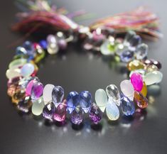 multicolored glass beads are arranged in a circle