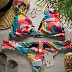 Brand New With Tags The Bikini Sets The Salt Saturation To Maximum With A Bold Tropical Print. Bikini Top The Vibrant Tropical Florals Are Paired With A Banded Tall Tri That Updates A Triangle Bikini Top With Longer, Fixed Cups And A Wide Underband. The Active Bikini Top Finds A Flirty Balance With Straps That Tie At The Shoulders. Adjustable Spaghetti Ties At Shoulders. Fixed Shape. Center Back Hook For Closure. Removable Cups. Bikini Bottom Printed With Vibrant Tropical Florals, The Hawaii Lo High Neck Swim Top, Tropical Florals, Billabong Swim, Tropical Bikinis, Billabong Women, Reversible Bikinis, Tropical Print, Tanning, Billabong