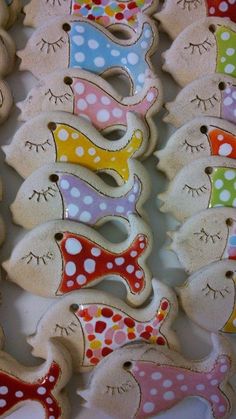 some decorated cookies are laying on a table