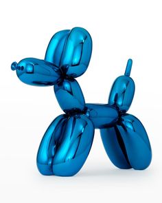 a blue balloon dog sitting on top of a table