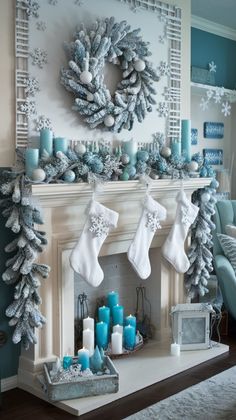 a fireplace decorated for christmas with stockings and candles