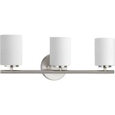 three light bathroom fixture with white shades on the sides and two lamps on each side