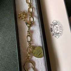 Never Used Juicy Couture Bracelet With Juicy Couture Crown Charm Included Elegant Metal Charm Bracelet With Logo Charm, Elegant Gold-tone Charm Bracelet With Logo, Elegant Metal Chain Bracelet With Logo Charm, Chic Jubilee Charm Bracelet For Gift, Chic Jubilee Charm Bracelet Gift, Chic Jubilee Charm Bracelet As Gift, Elegant Charm Bracelet With Logo Charm As Gift, Elegant Bracelets With Logo Charm For Gift, Elegant Bracelets With Logo Charm As Gift