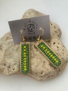 Minimalist Beaded long colorful earrings shaped as an U - urban collection. They are original and handmade. Wearing them is always comfortable. They are in a four colors: green, black , bronze, brass. They could be a nice present for anyone who loves urban earrings, urban style and designed geometric earrings. The size of the earrings is: 6x1 cm Please feel free to contact me if you have any questions. Check out my shop, where you can find a lot of beautiful beaded earrings. Thank you for visiting my shop. Bohemian Green Beaded Earrings For Everyday, Green Bohemian Beaded Earrings For Everyday, Multicolor Bohemian Rectangular Beaded Earrings, Colorful Beaded Brown Dangle Earrings, Unique Yellow Beaded Earrings, Multicolor Beaded Brass Earrings, Multicolor Hand-strung Beaded Earrings, Beautiful Beaded Earring, Colors Green