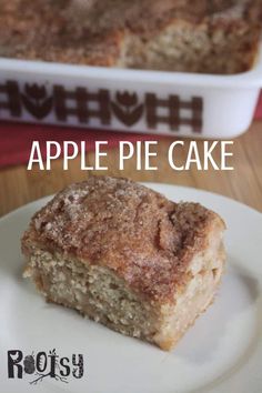 a piece of apple pie cake sitting on top of a white plate next to a baking dish