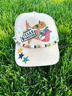 PLEASE READ DESCRIPTION: This adorable FAUX PATCH trucker hat is so fun and perfect for all those summer adventures. These fabulous hats have printed fronts made to look like real patches. The stars on the bill are included and are actual patches. We offer these printed designs as a less $$ option so that everyone can enjoy this popular trucker hat trend! **Our beaded chains/charms are sold separately. **Front design is PRINTED to look like patches. These are FAUX PATCH hats. **Star patches are embroidered and included in this particular design **We do not accept returns for failure to read the description. Trucker Snapback Hat For Country Events, Country Style Adjustable Trucker Hat For Spring, Adjustable Country Style Trucker Hat For Spring, Adjustable Snapback Trucker Hat For Country Events, Country Style Adjustable Snapback Hat, Adjustable Baseball Cap For Country Events, Adjustable Trucker Snapback Hat For Rodeo, Adjustable Snapback Trucker Hat For Rodeo, Adjustable Trucker Cap For Rodeo