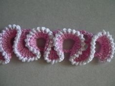 three crocheted letters that spell out the word god