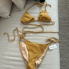 Kendall And Kylie Swimsuit Bikini Sparkle Gold Top Is A Medium Bottom Is A Large Never Been Worn With Tags Pet Free And Smoke-Free Home Gold Summer Swimwear, Gold Swimwear For Summer Beach Party, Gold Tie-side Bottom Swimwear For Swimming, Gold Tie-side Swimwear For Beach Season, Gold One-piece Swimwear For Poolside, Gold Summer Swimwear For Poolside, Gold Backless Swimwear For Vacation, Gold Fitted Swimwear For Sunbathing, Fitted Gold Swimwear For Beach Party