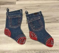 two pairs of blue jeans with red hearts on the bottom and one pair is made out of