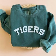 Cozy up with our Comfort Colors Custom Crewneck Sweatshirt during fall and football season! Perfect way to show your school spirit all year round! - Our sweatshirt material is super soft and high quality! ♡ - Garment-Dyed Sweatshirt (Sustainable style)  - 80% cotton, 20% polyester - All our sweatshirts run a UNISEX fit. (Both for men and women) They fit true to size. But if you like a more baggy look, we highly recommend sizing up. - These letters are embroidered iron-on patches that have been h Varsity Style Tops With Letter Patch And Crew Neck, Sporty Tops For Game Day In Fall, Sporty Tops With Ribbed Cuffs For Game Day, Winter Letter Print Sweatshirt For School, Winter School Sweatshirt With Letter Print, Sporty T-shirt With Ribbed Cuffs For Fall, School Varsity Sweatshirt, Cotton Sports Sweatshirt For Fall, Cotton Sweatshirt For Sports In Fall