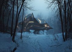 a futuristic building in the middle of a snowy forest