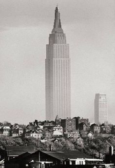 a black and white photo of the empire state building in new york city, ny