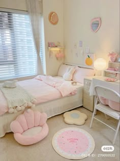 a bedroom with pink furniture and accessories in it