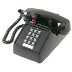 an old style phone with buttons and dials on the front, sitting against a white background